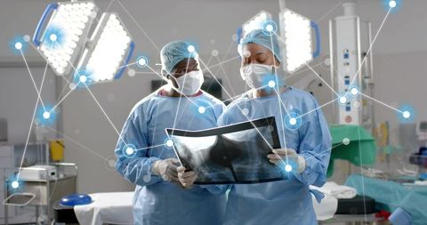 Surgeons Reviewing X-Ray in Operating Theater with Digital Overlay