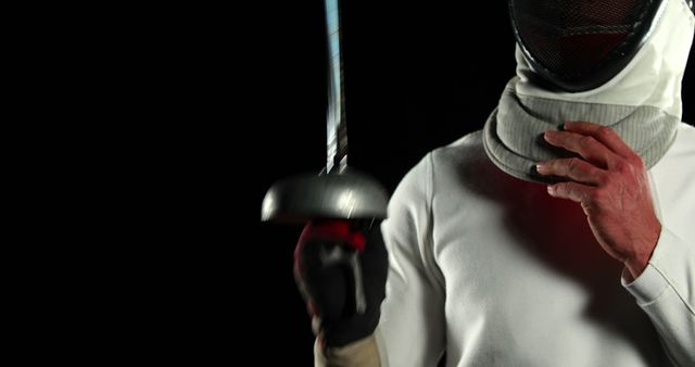 Fencer Holding Sword Preparing for Match in Darkness - Download Free Stock Images Pikwizard.com
