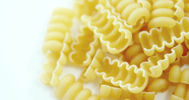 Close-Up of Uncooked Radiatori Pasta in Yellow Hue - Download Free Stock Images Pikwizard.com