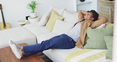African American Man Smiling Relaxing Couch - Download Free Stock Images Pikwizard.com