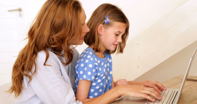 Mother Assisting Daughter Using Laptop for Online Learning - Download Free Stock Images Pikwizard.com