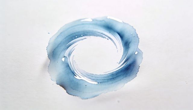 Cerulean watercolor ring with glossy droplets on textured paper, abstract blue wash and granulation