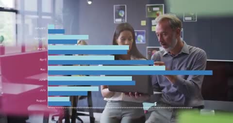 Experts Analyzing Digital Data Charts in Modern Office