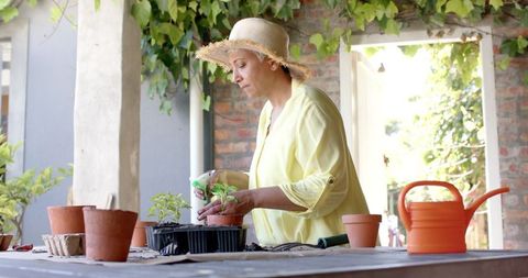Senior Woman Gardening in Stylish Sun Hat