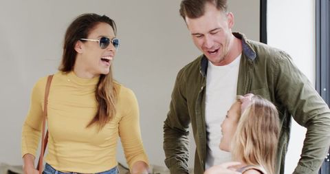 Smiling Family Returning Home After Vacation Bonding Together