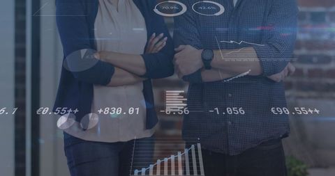 Business team analyzing financial holograms in modern office