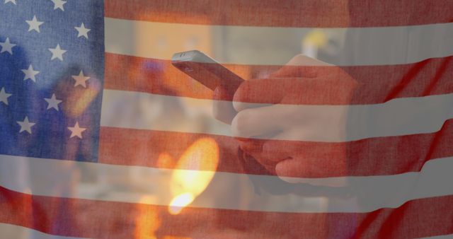 Image shows a person holding a smartphone with an overlay of the American flag. Perfect for themes of patriotism, technology, communication in the USA, mobile usage, and national pride articles or advertisements.
