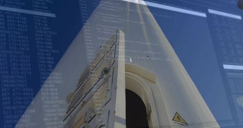 Upward view wind turbine nacelle hatch with safety sticker and digital code overlay