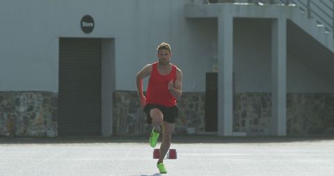 Athletic Male Sprinting on Outdoor Track