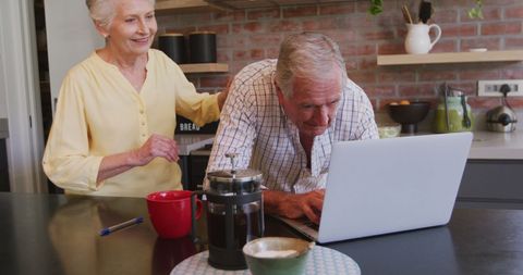 Senior Caucasian Couple Enjoying Morning Coffee at Kitchen Counter - Download Free Stock Images Pikwizard.com