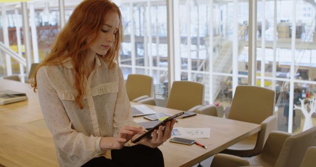 Confident Businesswoman Working on Tablet in Modern Office - Download Free Stock Images Pikwizard.com