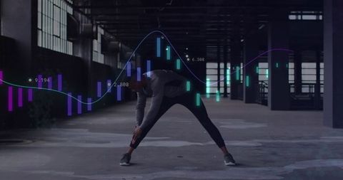 Athlete stretching in industrial loft with digital finance chart overlay