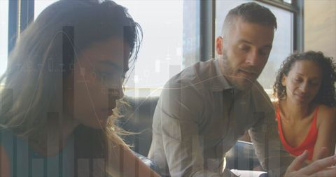 Diverse Team Analyzing Financial Data at Office