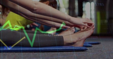 Fitness Enthusiasts Stretching on Mats with Transparency Chart