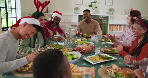 Diverse family celebrating festive holiday meal together