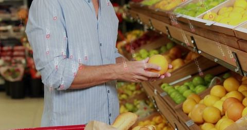 Shopper Choosing Citrus in Grocery Store Produce Aisle