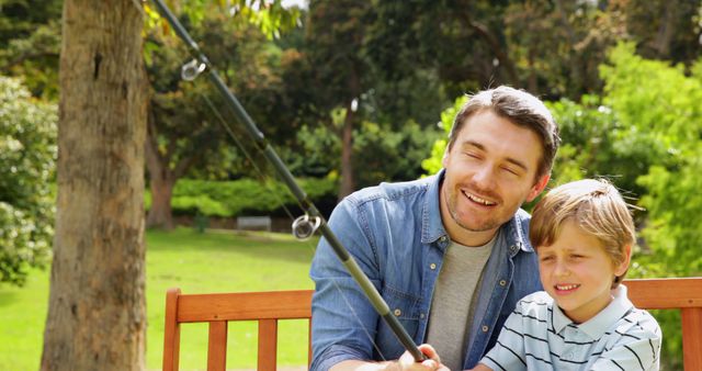 Father and Son Spending Quality Time Fishing Together in Park - Download Free Stock Images Pikwizard.com