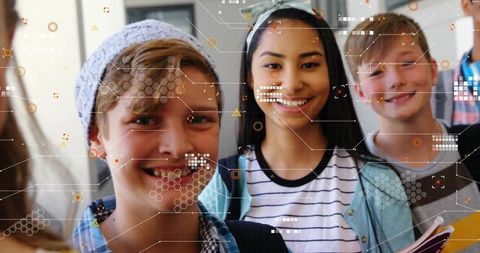 Smiling teenage students wearing backpacks using augmented reality hud in school hallway