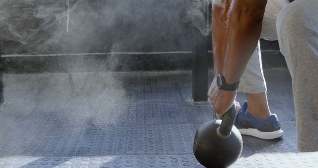 Athlete Gripping Kettlebell Preparing for Weightlifting Workout - Download Free Stock Images Pikwizard.com