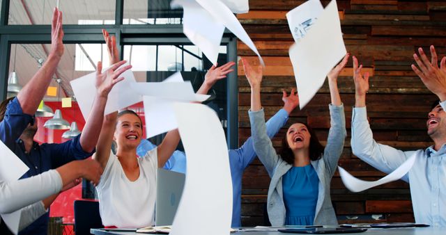 Business Team Celebrating Success by Tossing Papers in the Air - Download Free Stock Images Pikwizard.com
