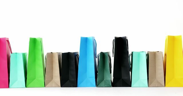 Colored Shopping Bags in Row on White Background - Download Free Stock Images Pikwizard.com