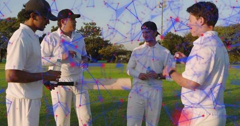 Cricket teammates planning midgame strategy on turf with digital analytics overlay