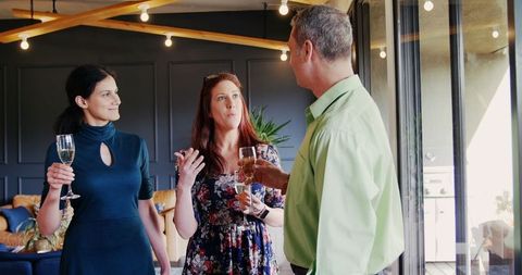 Colleagues socializing at casual evening gathering