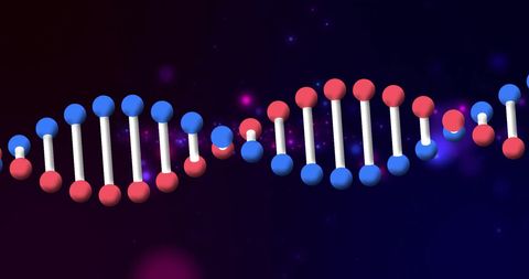 Colorful dna strand structure against dark glowing background