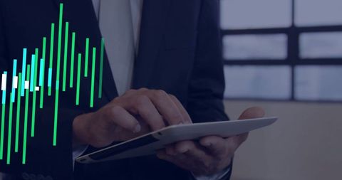 Business professional using tablet with data chart overlay