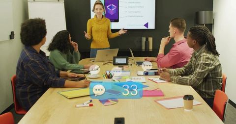 Presenter leading creative team meeting with laptop, slides and chat notification overlay