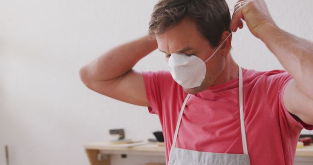 Carpenter Wearing Safety Mask in Workshop - Download Free Stock Images Pikwizard.com