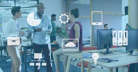 Multigenerational team discussing over coffee in open office with floating digital icons