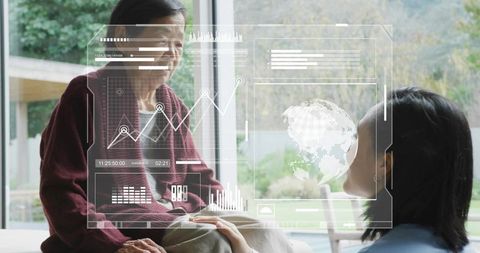 Grandmother and Granddaughter Holding Hands by Window Viewing Holographic Data Interface