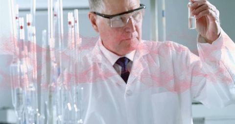 Scientist examining test tube in modern laboratory environment