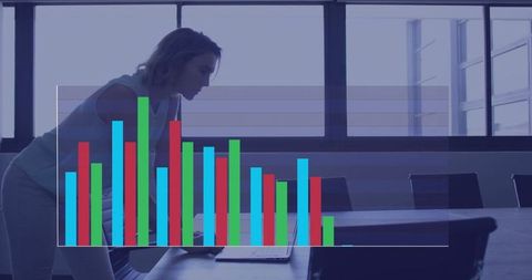 Businesswoman Analyzing Data with Graphs in Modern Office
