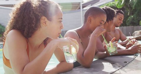 Friends Enjoying Poolside Drinks Outdoors