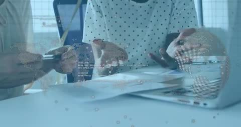 Coworkers Collaborating with Transparent World Map Overlay