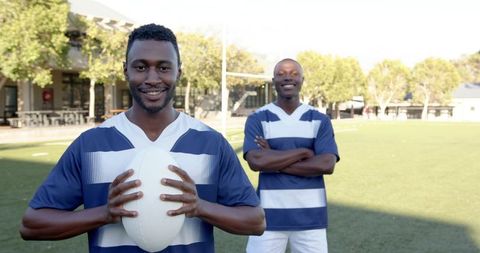 Rugby Teammates Smiling on Sports Field