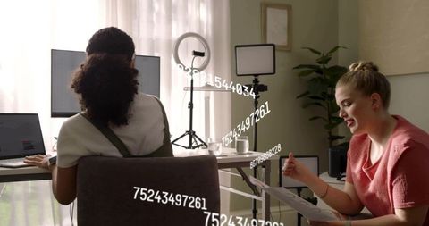 Women Collaborating in Home Studio Reviewing Video Edits and Content Production Workflow
