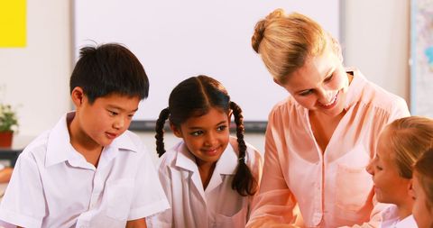 Teacher Engaging Students with Tech in Classroom Interaction - Download Free Stock Images Pikwizard.com