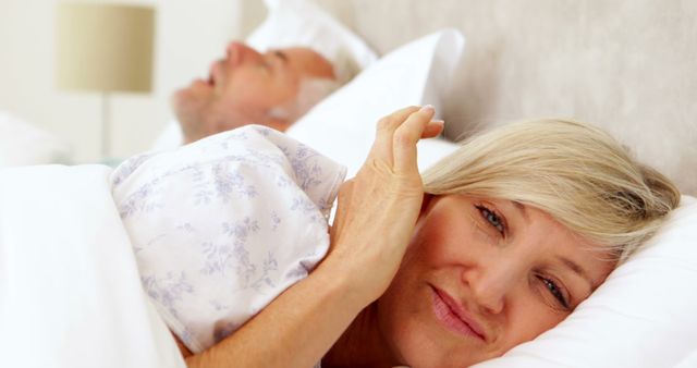 Senior Woman Awake In Bed Disturbed By Snoring Partner - Download Free Stock Images Pikwizard.com