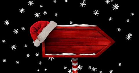 Festive Red Arrow Sign with Snowflakes and Santa Hat