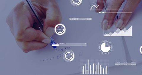 Woman writing notes with digital data overlays displaying charts, graphs and analytics