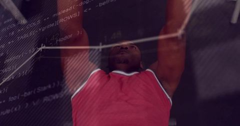 Male athlete pressing barbell with code overlay double exposure fitness concept
