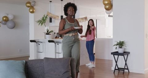 Couple Preparing for Birthday Party with Fun and Joy at Home