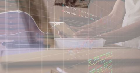 Hands Using Tablet with Digital Financial Data Interface