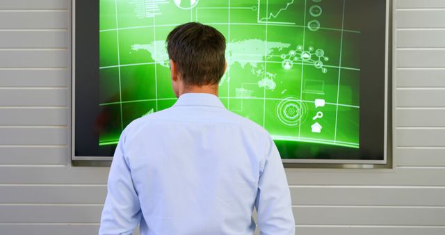 Businessman Analyzing Digital Data on Interactive Green Screen - Download Free Stock Images Pikwizard.com