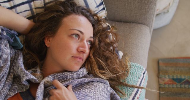 Contemplative Woman Relaxing at Home in Cozy Blanket - Download Free Stock Images Pikwizard.com