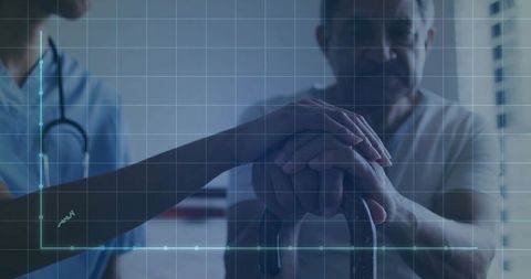 Nurse holding senior man's hands over cane conveying compassionate elderly care support