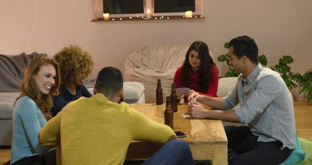 Friends Playing Cards and Drinking Beer in Cozy Living Room - Download Free Stock Images Pikwizard.com